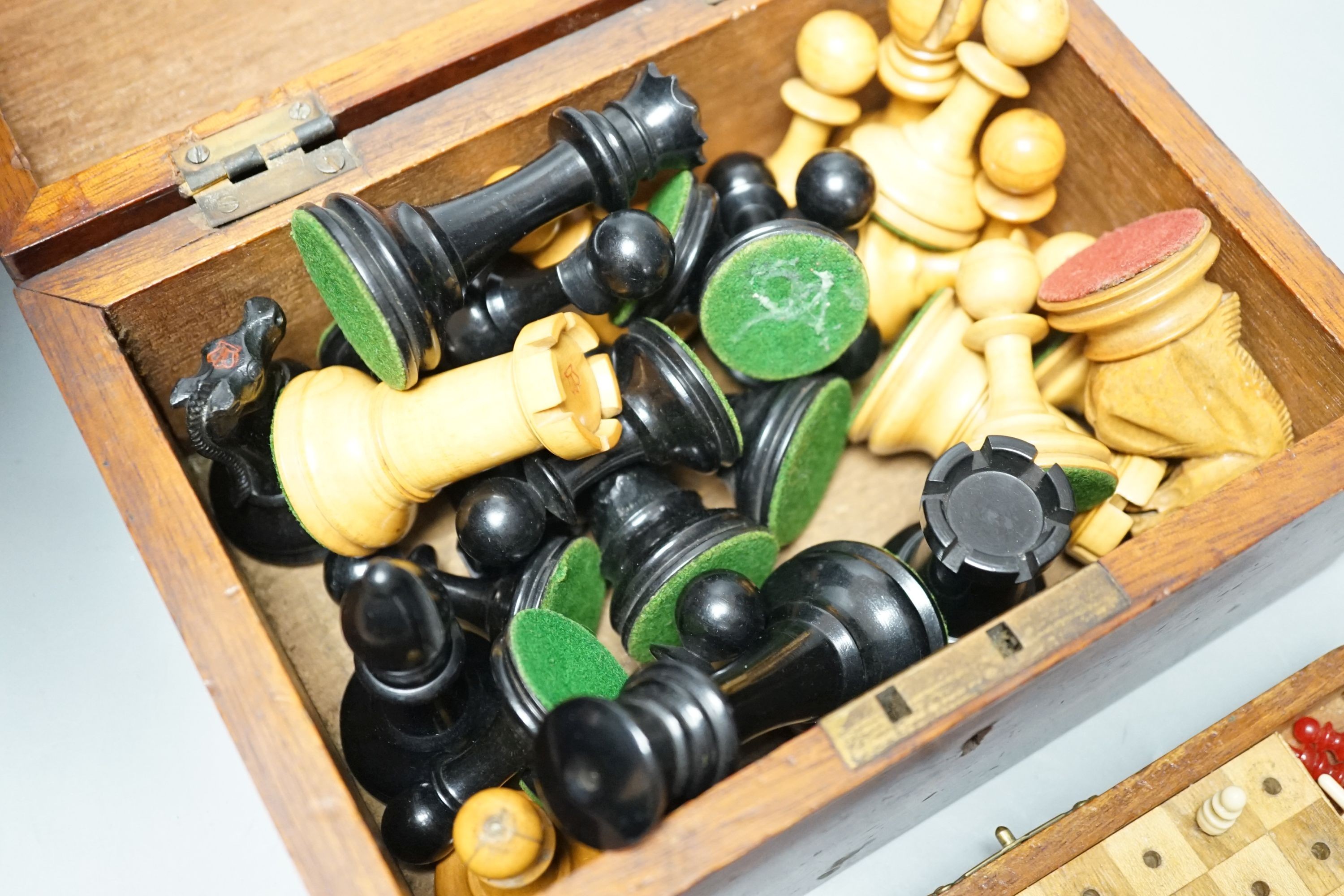 A Staunton chess set, some associate pieces and a miniature chess set. King height - 9cm